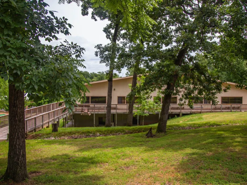 Dining Hall at Camp Barnabas surrounded by trees
